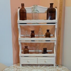 Vintage White Wall Display Shelf with Brown Bottles